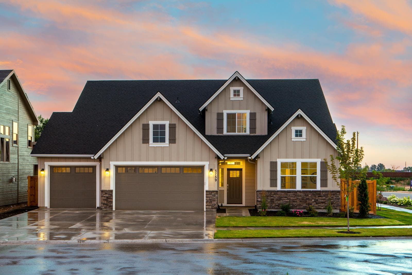 Restored craftsman bungalow exterior with wide front porch, exposed rafters, and tapered columns in the Pacific Northwest