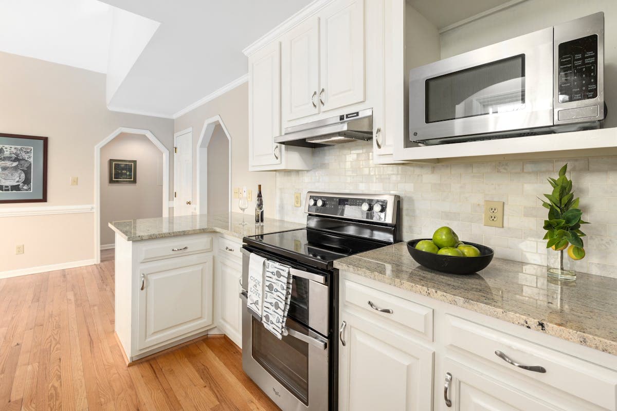 White quartz countertop in a modern kitchen renovation with clean lines